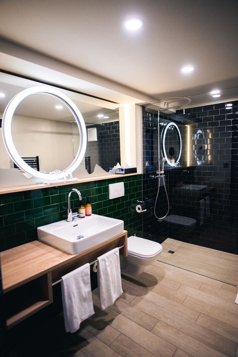 Modern bathroom with green tiles