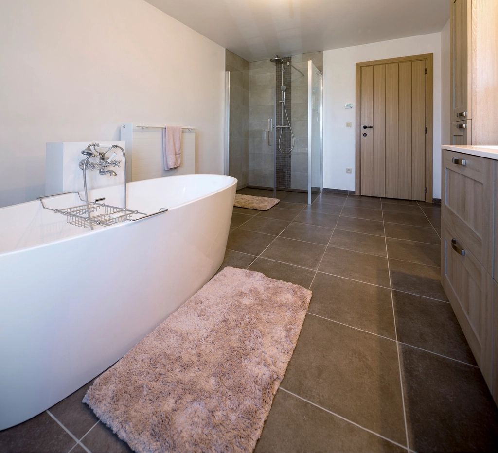 Finished bathroom with freestanding bath